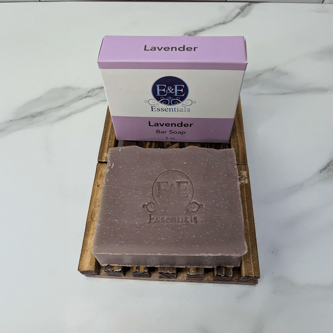 Lavender bar soap with packaging on a marble surface